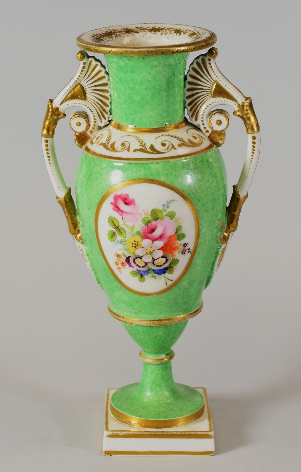 A SWANSEA PORCELAIN VASE with twin handles and of slender ovoid form, flared rim and with a round