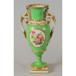 A SWANSEA PORCELAIN VASE with twin handles and of slender ovoid form, flared rim and with a round