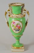 A SWANSEA PORCELAIN VASE with twin handles and of slender ovoid form, flared rim and with a round