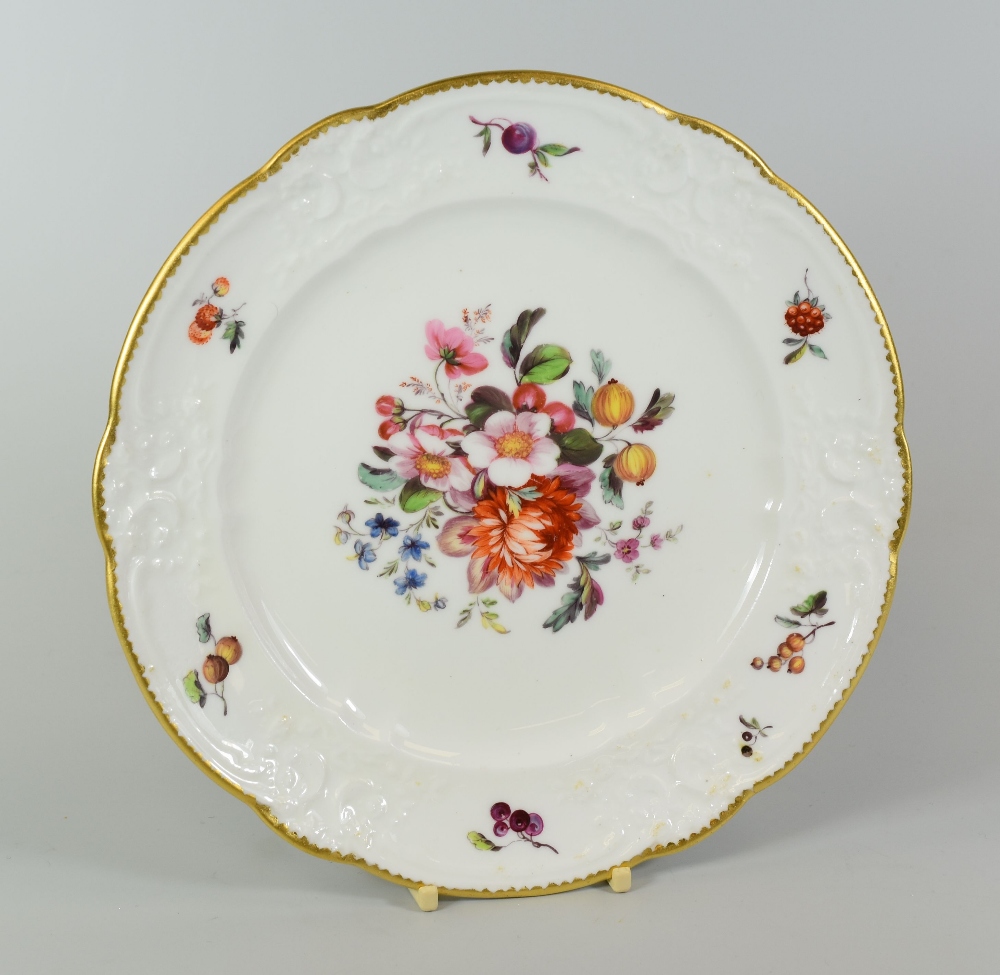 A NANTGARW PORCELAIN PLATE having a lobed border with moulded scrolls, foliage and ribbons