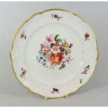 A NANTGARW PORCELAIN PLATE having a lobed border with moulded scrolls, foliage and ribbons