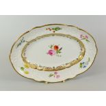 A SWANSEA PORCELAIN OVAL DISH of lobed form and moulded border of scrolls, foliage and ribbons,