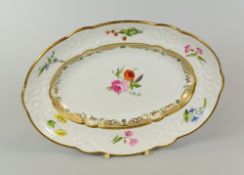 A SWANSEA PORCELAIN OVAL DISH of lobed form and moulded border of scrolls, foliage and ribbons,