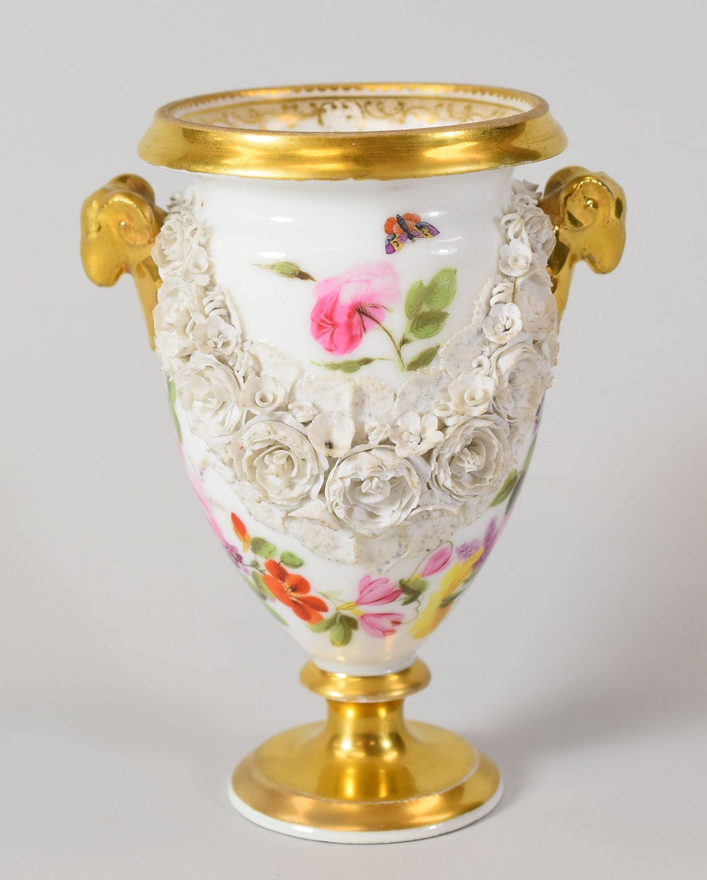 SWANSEA PORCELAIN URN SHAPED VASE having twin ram's head handles, a thick everted rim and the body