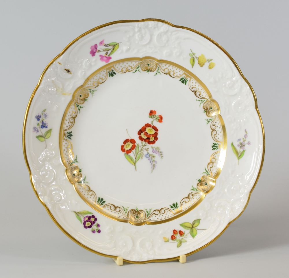 A SWANSEA PORCELAIN DESSERT PLATE with lobed rim and having a moulded border with C-scrolls,