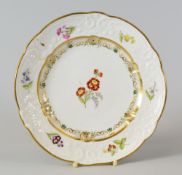 A SWANSEA PORCELAIN DESSERT PLATE with lobed rim and having a moulded border with C-scrolls,