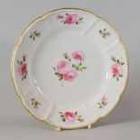 SWANSEA PORCELAIN CRUCIFORM DISH with a beaded border and painted with sprigs of roses to the border