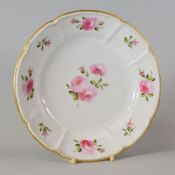 SWANSEA PORCELAIN CRUCIFORM DISH with a beaded border and painted with sprigs of roses to the border