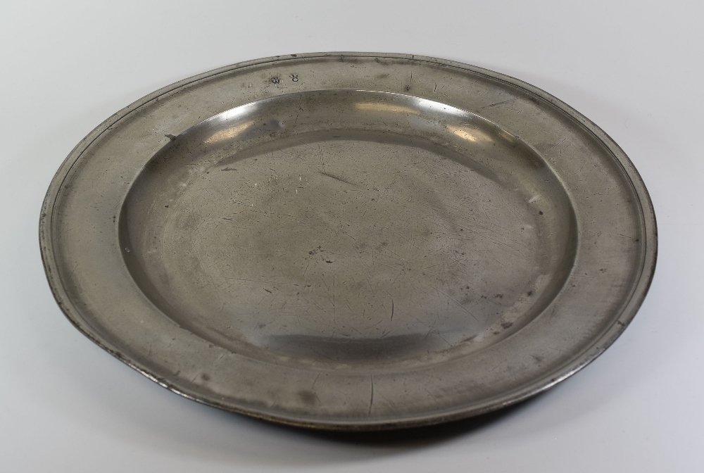 18TH CENTURY PEWTER CHARGER of plain form and believed to be connected to Bassaleg, Gwent as