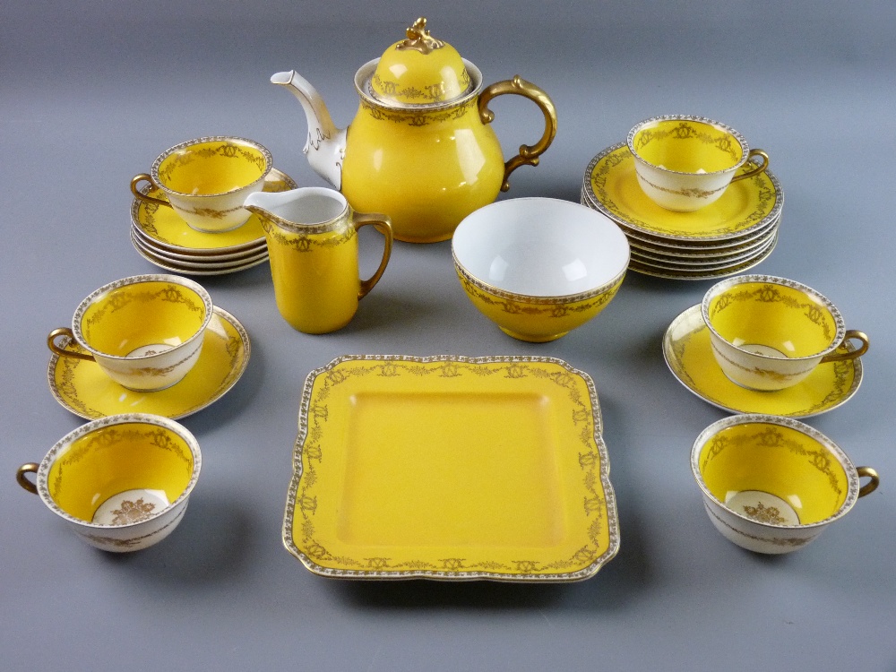 A TWENTY TWO PIECE KPM BERLIN PORCELAIN TEASET, yellow ground with wreath and floral swag gilt