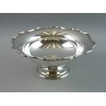 A SILVER PEDESTAL BOWL with wavy rim, 25.5 cms diameter, Birmingham 1929, 16 troy ozs