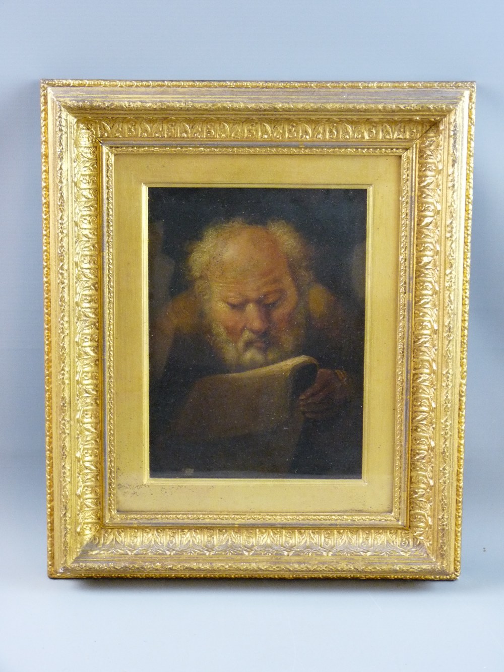 19th CENTURY CONTINENTAL SCHOOL oil on board - bearded gentleman closely reading a book, unsigned,