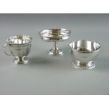 A SILVER CUP AND TWO FURTHER ITEMS, the segmented cup with reeded border on a circular foot,