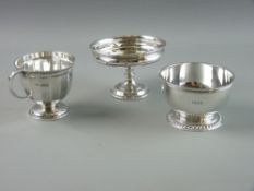 A SILVER CUP AND TWO FURTHER ITEMS, the segmented cup with reeded border on a circular foot,