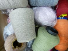 A VERY LARGE PARCEL OF KNITTING MACHINE WOOL contained in a tin trunk, four cardboard boxes and