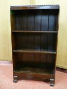 A NEAT MAHOGANY THREE SHELF BOOKCASE with shaped lower apron on reeded feet, 92 cms high, 53.5 cms