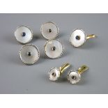 A MATCHING PARCEL OF FIVE EIGHTEEN CARAT PLATINUM & MOTHER OF PEARL CIRCULAR BUTTONS with matching