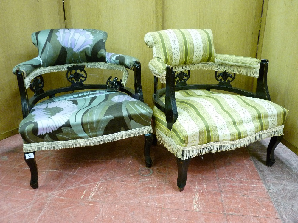 A PAIR OF EDWARDIAN EBONIZED TUB TYPE ELBOW CHAIRS with padded backs