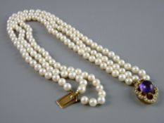 A TRIPLE NECKLACE OF UNIFORM NATURAL PEARLS having a nine carat oval clasp adorned with seed