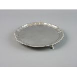 A SILVER THREE FOOTED CARD TRAY with wavy border and gadrooned edge, London 1905, 12.5 troy ozs,