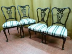 TWO PAIRS OF EDWARDIAN MAHOGANY SALON CHAIRS with carved pierced top rail and splatback, classically