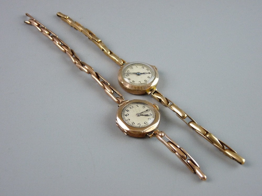 TWO LADY'S NINE CARAT GOLD ENCASED CIRCULAR DIAL WRISTWATCHES, each with an expanding bracelet, 29