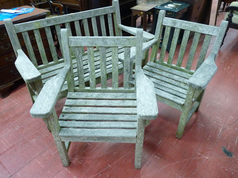 A TEAK GARDEN BENCH & PAIR OF ARMCHAIRS with slatted backs and seats, 133 cms wide the bench