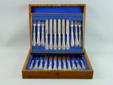 A WOODEN CANTEEN OF EARLY 20th CENTURY DESSERT/FRUIT KNIVES AND FORKS, twelve knives and twelve for