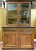 A LATE VICTORIAN MAHOGANY CUPBOARD having two drawers with turned knobs, two base cupboards with