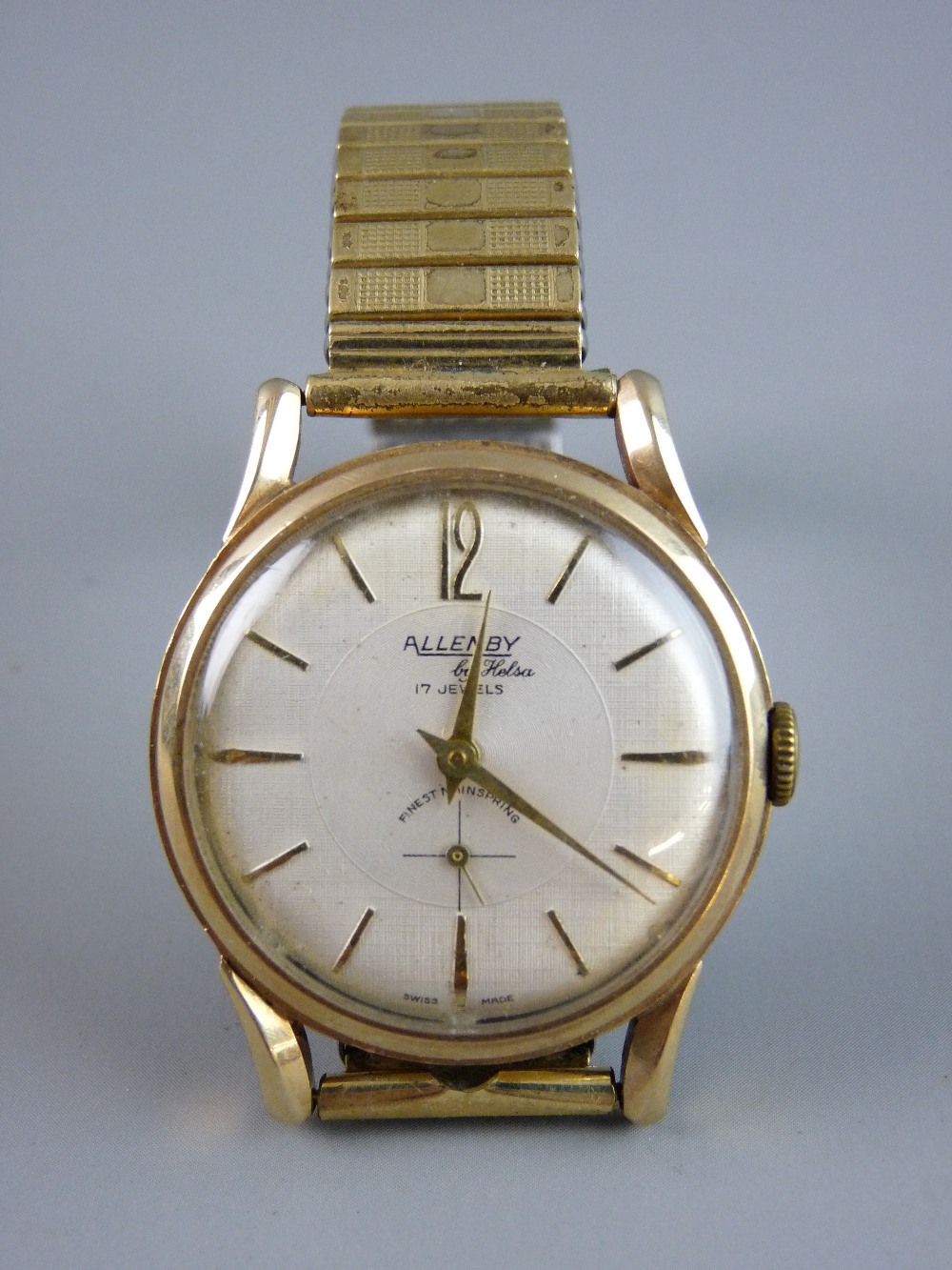 A GENT'S ALLENBY SEVENTEEN JEWEL CIRCULAR DIAL NINE CARAT GOLD ENCASED WRISTWATCH by Helsa with