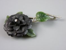 AN ATTRACTIVE FINE QUALITY WHITE METAL FLORAL BROOCH having a black bog oak style flower with