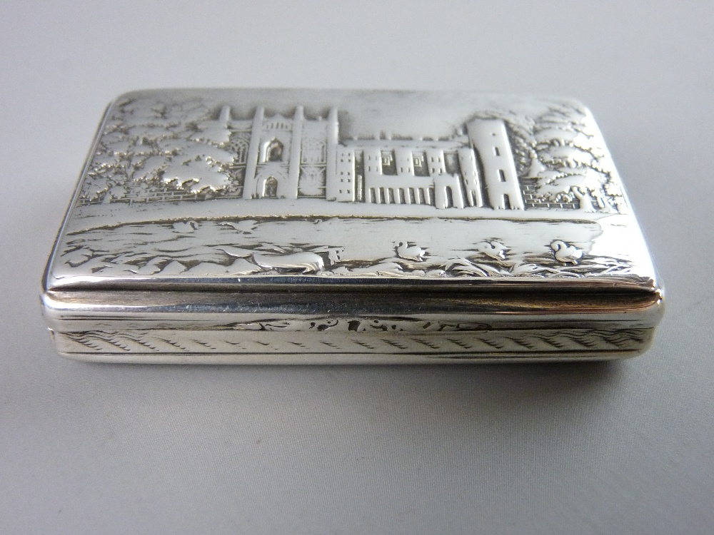A NATHANIEL MILLS CASTLE TOP SILVER SNUFF BOX of rectangular form with gilt interior showing