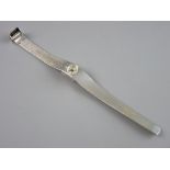 A LADY'S SILVER ENCASED (circa London 1977) OVAL DIAL EXCALIBUR WRISTWATCH with incorporated and