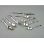 A PARCEL OF SEVEN SILVER MUSTARD/SALT SPOONS and a silver butter knife, total 4 troy ozs