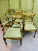 A SET OF SEVEN (six plus one) VICTORIAN MAHOGANY CURVED BACK DINING CHAIRS with drop-in seats and