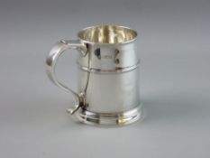 A SILVER TANKARD of tapering cylindrical form with banding, London 1913, 11.6 troy ozs