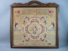 AN OAK FRAMED NEEDLEWORK SAMPLER having a floral and rope central panel, sixteen line verse above '