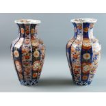 A PAIR OF GOOD JAPANESE IMARI VASES, late 19th Century, typical palette, the bodies in the form of