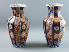 A PAIR OF GOOD JAPANESE IMARI VASES, late 19th Century, typical palette, the bodies in the form of