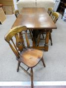 A GOOD OAK OBLONG REFECTORY DINING TABLE having a centre stretcher and turned and block supports,