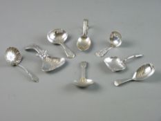 A PARCEL OF EIGHT MIXED SILVER CADDY SPOONS, 3.8 troy ozs total