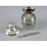 THREE SILVER DESK ITEMS to include a silver topped and glass inkpot, London 1831, a pencil holder