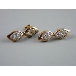 A PAIR OF NINE CARAT ROSE GOLD DOUBLE DROP EARRINGS, each drop having four round czs, 6 grms