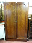 A VICTORIAN MAHOGANY TWO DOOR WARDROBE with interior base shelf, no cornice