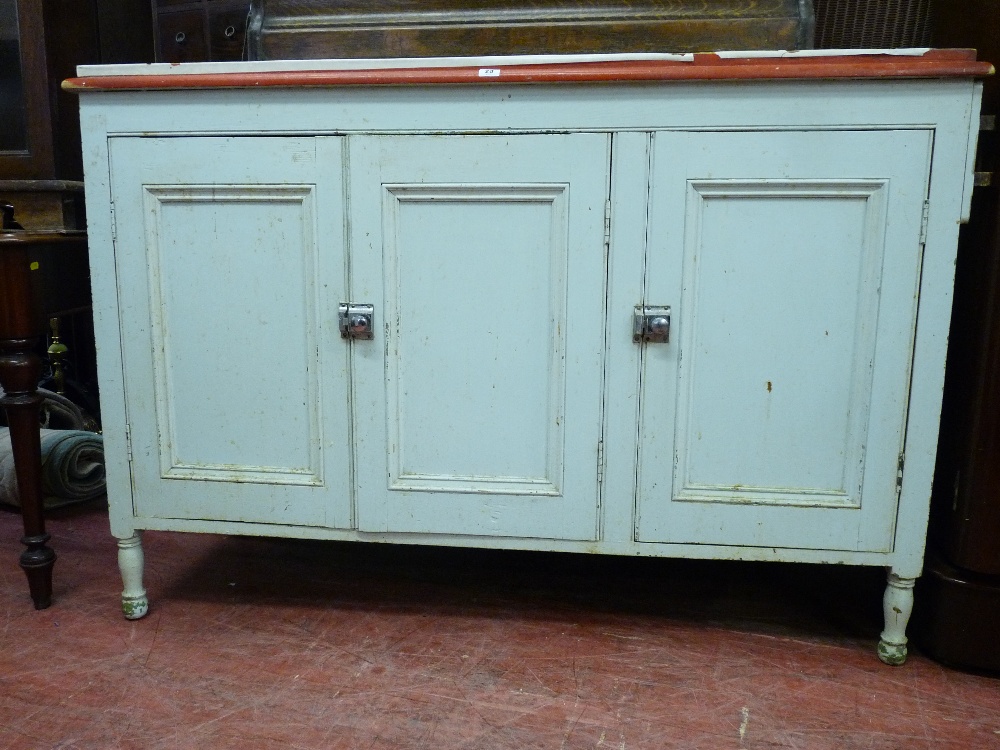 A PAINTED PINE KITCHEN CUPBOARD WITH RAILBACK and three doors with chrome snap catches, 55 cms wide