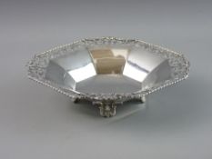 A SILVER FOUR FOOTED BOWL with segmented interior, pierced rim and rope twist edge, Birmingham 1931,