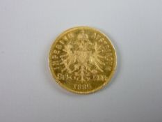 AN AUSTRIAN EIGHT FLORIN TWENTY FRANC GOLD COIN 1885