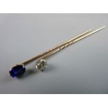 A GOLD TWIST STICK PIN with diamond, estimated 0.5 carat and another gold twist stick pin with