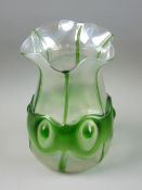 A LOETZ STYLE IRIDESCENT GLASS VASE, fluted rim with green rib and bullseye collar decoration with