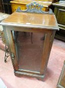 AN EDWARDIAN MAHOGANY SINGLE GLAZED DOOR MUSIC CABINET with carved railback